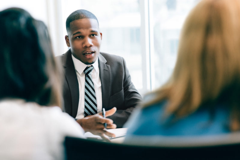 Vanguard Franchise Adviser with two women in meeting